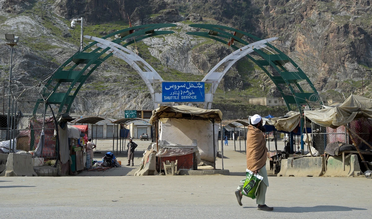 A man walks past an empty bus terminal near the closed Pakistan-Afghanistan border amid concerns over the spread of the COVID-19 novel coronavirus, in Torkham some 54 kms from Peshawar on March 16, 2020. (AFP)