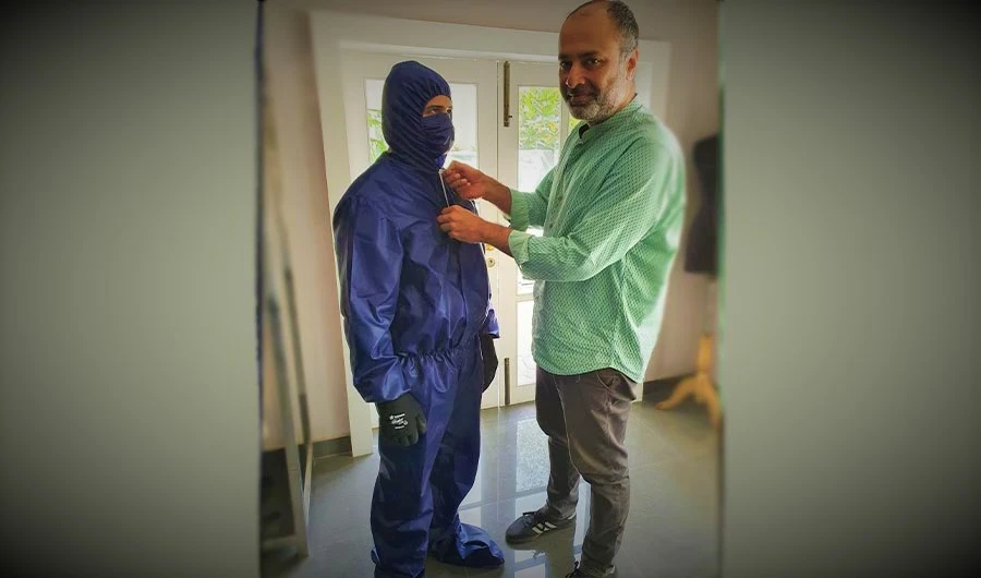 In this undated photo, designer Deepak Perwani inspects a Personal Protection Equipment suit in Karachi. (Photo Courtesy: Deepak Perwani)