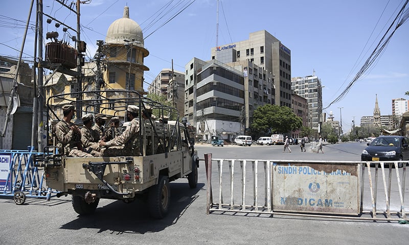 In this photo Sindh Police patroling on deserted streets of Karachi amid coronavirus lockdown. (AP)