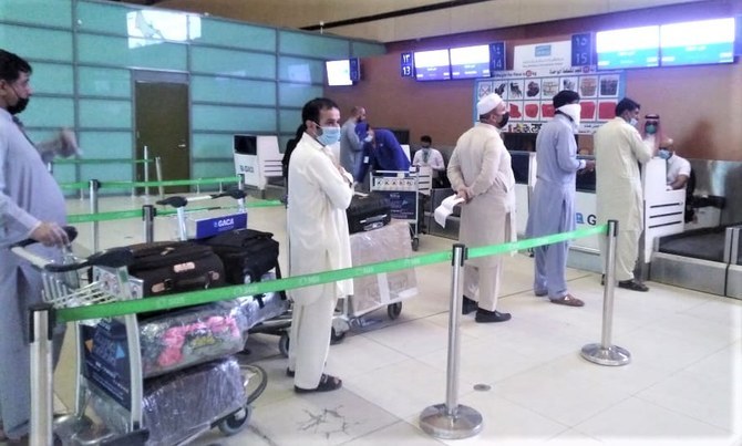 In this file photo, Pakistani nationals arrive at the airport in Jeddah, Saudi Arabia, to board a special flight to Lahore on May 1, 2020. (Photo courtesy: Pakistan Consulate General in Jeddah)