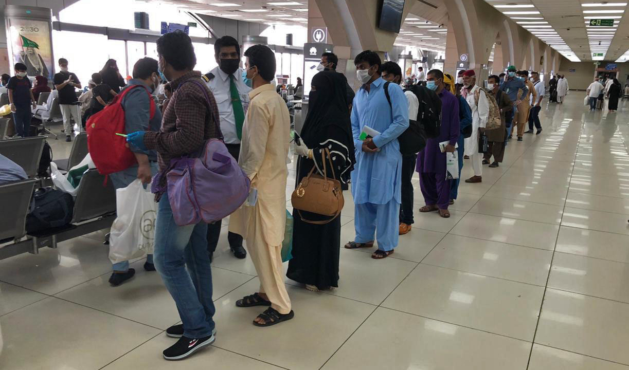 Pakistani passengers at King Abdulaziz International Airport in Jeddah before departing for Karachi via a special PIA flight on May 16, 2020. (Photo courtesy: Pakistan Consulate Jeddah)