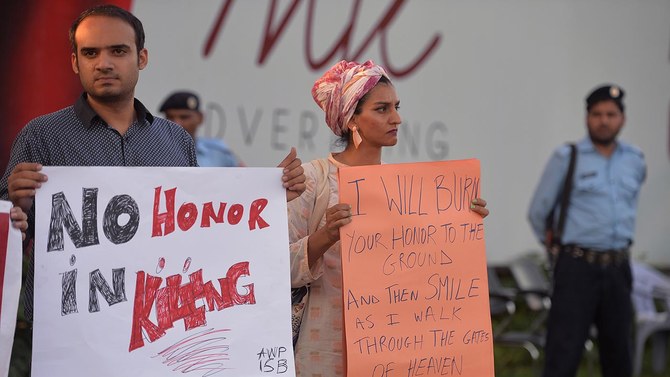 Pakistani civil society activists carry placards during a protest against Honor Killings in Islamabad on July 18, 2016. (AFP/File)