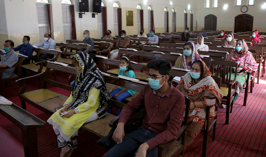 Christians wear protective masks as they attend Mass while maintaining a social distance at the Central Brooks Memorial Church in Karachi, Pakistan, Sunday, May 17, 2020. Pakistani churches welcomed worshippers for Sunday Mass for the first time in nearly two months, as authorities eased restrictions imposed in March to limit the spread of coronavirus. (AP)