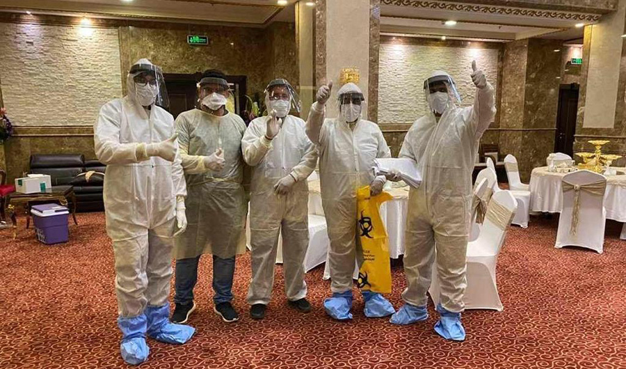 Dr Zia Ullah Khan Dawar is posing for a photograph with other members of Saudi Arabia's COVID-19 team at a quarantine center in Makkah. (Photo courtesy: Zia Ullah Khan Dawar)