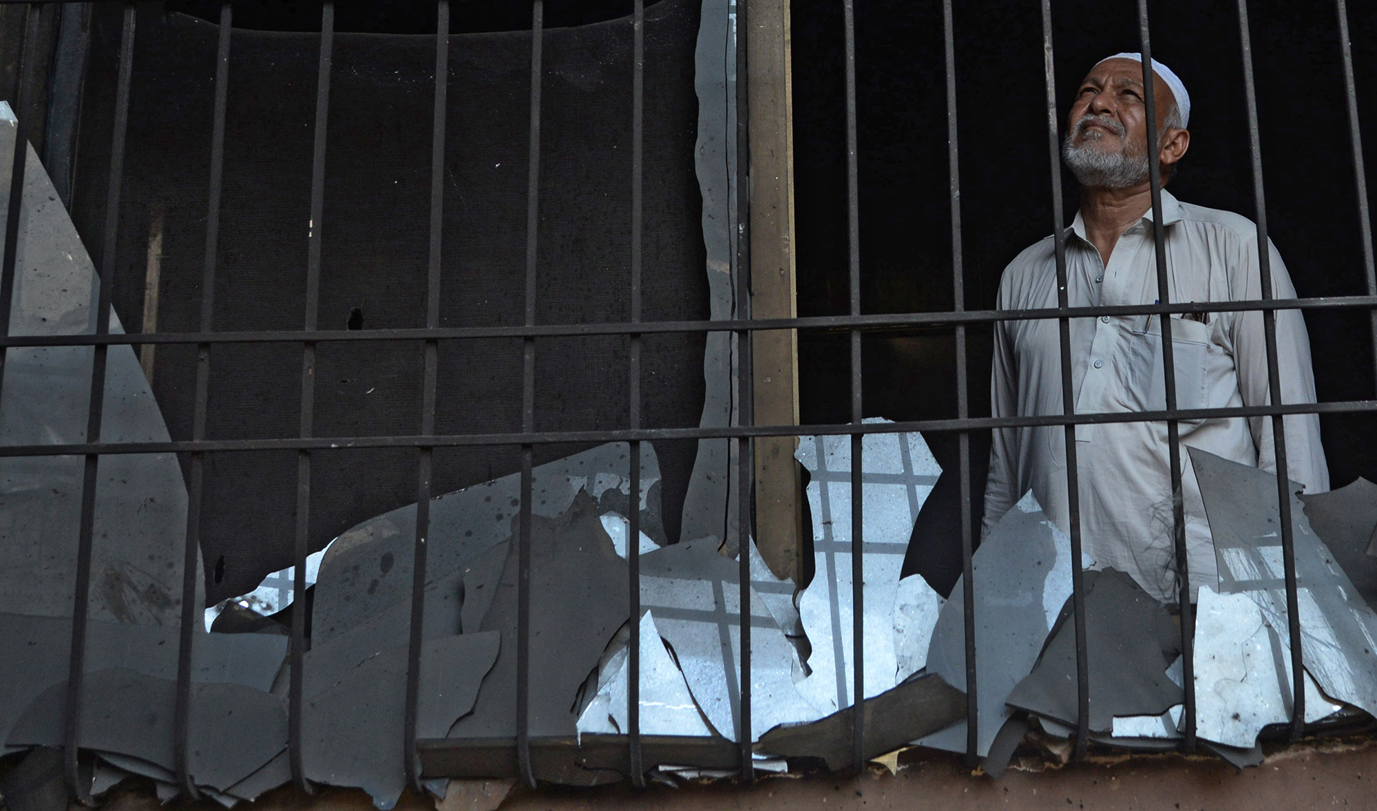 A resident of Karachi’s Model Colony looks upon his damaged home on May 23, 2020, a day after a Pakistan International Airlines’ aircraft crashed into a residential neighbourhood near Karachi airport. (AN photo by S.A. Babar)