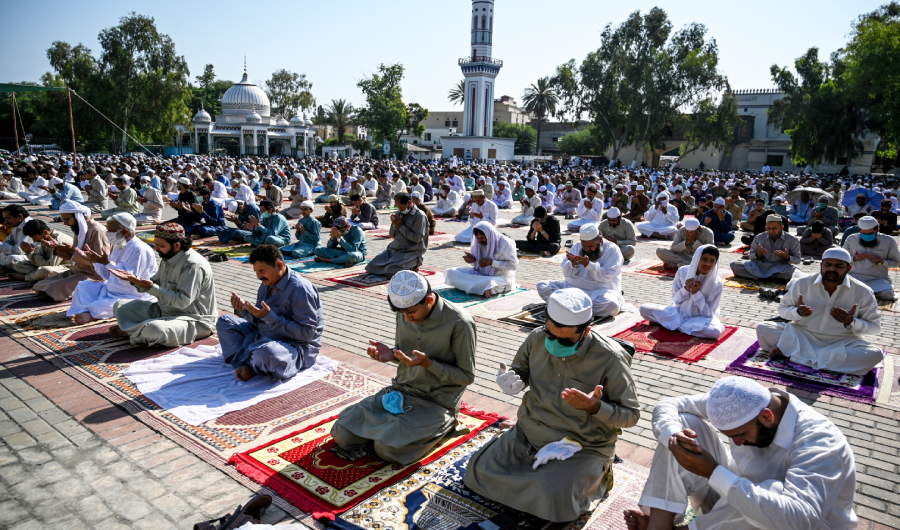 Muslims offer Eid al-Fitr prayers at the Eidgah Sharif Darbar in Rawalpindi on May 24, 2020. Muslims around the world are celebrating the Eid al-Fitr festival, which marks the end of the fasting month of Ramadan. (AFP)