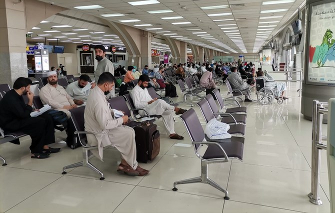 Pakistani nationals stranded in Saudi Arabia are waiting for a special flight to Faisalabad at Jeddah International Airport on May 18, 2020. (Photo courtesy: Pakistan Consulate General in Jeddah)
