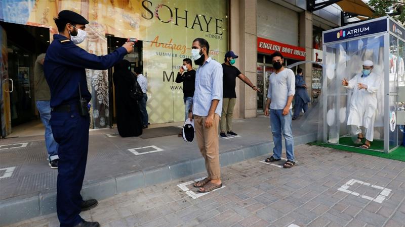 People in the Pakistani city of Karachi have started going to shopping malls again after they reopened following a Supreme Court on May 18, 2020. (Reuters)