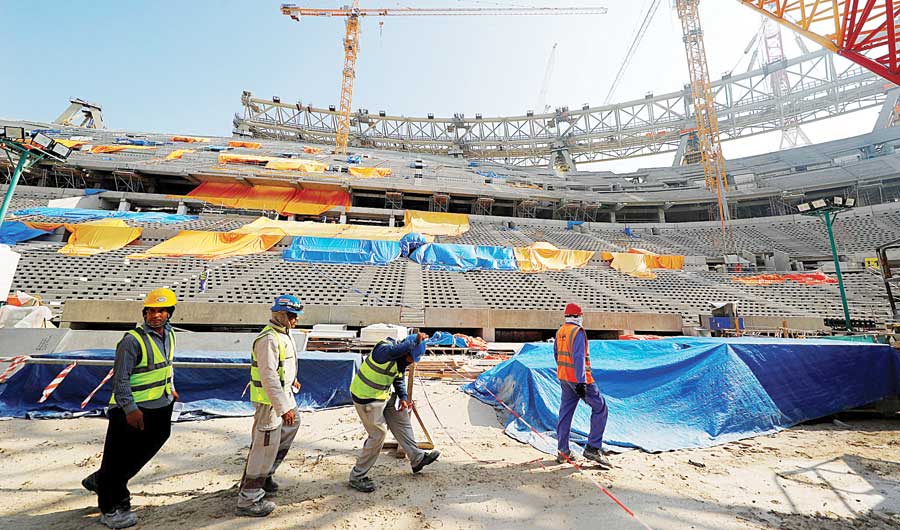 Workers inside the Lusail Stadium on Dec. 20, 2019. The stadium is under construction for the 2022 FIFA World Cup, scheduled to be held in Doha, Qatar. (REUTERS/File)
