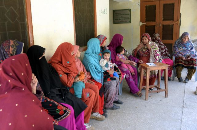 In this photograph taken on May 27, 2016, Pakistani health worker Zeweer Jan (2nd R) speaks with pregnant Kashmiri women at a healthcare centre in the village of Sharda in the Neelum Valley. (AFP)