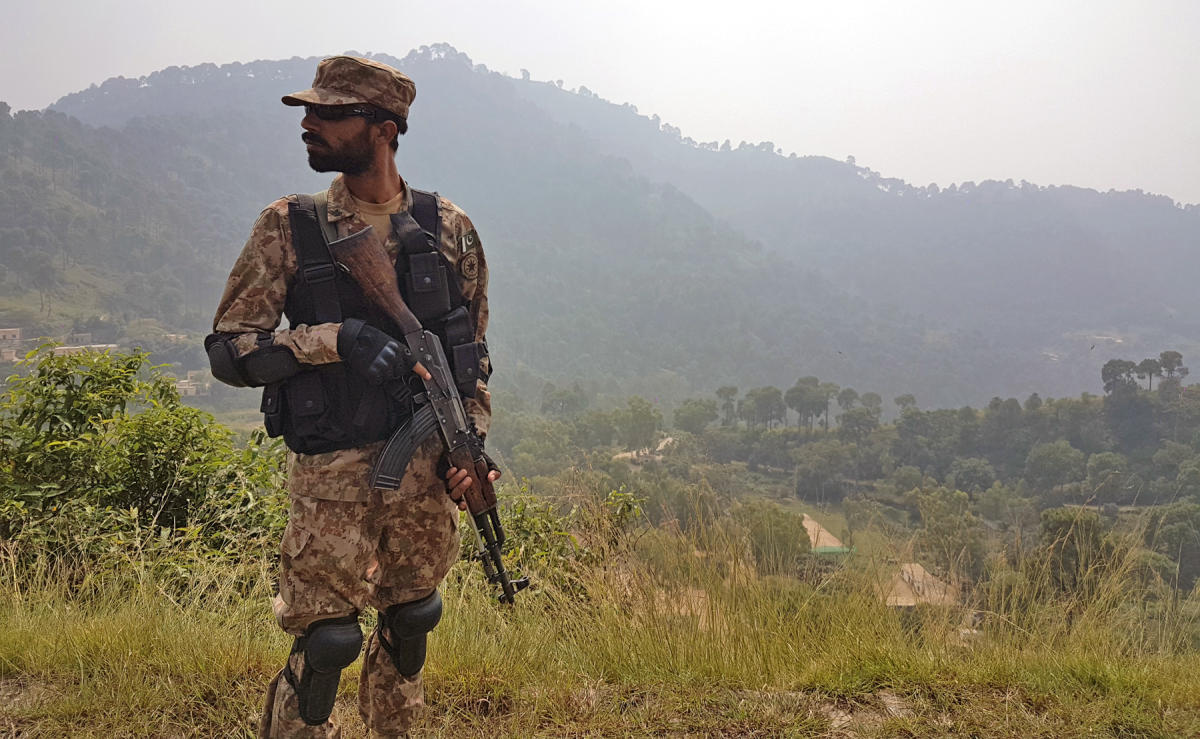 In this file photo, a Pakistani soldier patrols a village in district Bhimber near the Line of Control (LoC) in Pakistan-administered Kashmir during a media trip organized by the Pakistani army on Oct. 1, 2016. (AFP)