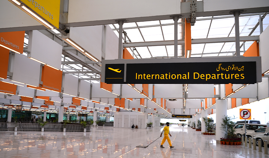A Pakistani worker cleans a floor at the Islamabad International Airport on April 18, 2018. (AFP)