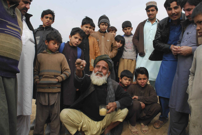 In this Thursday, Feb. 13, 2020 photo, Afghan refugee Hukam Khan narrates the situation of his country, at Kabobayan refugee camp, in Peshawar, Pakistan. (AP)