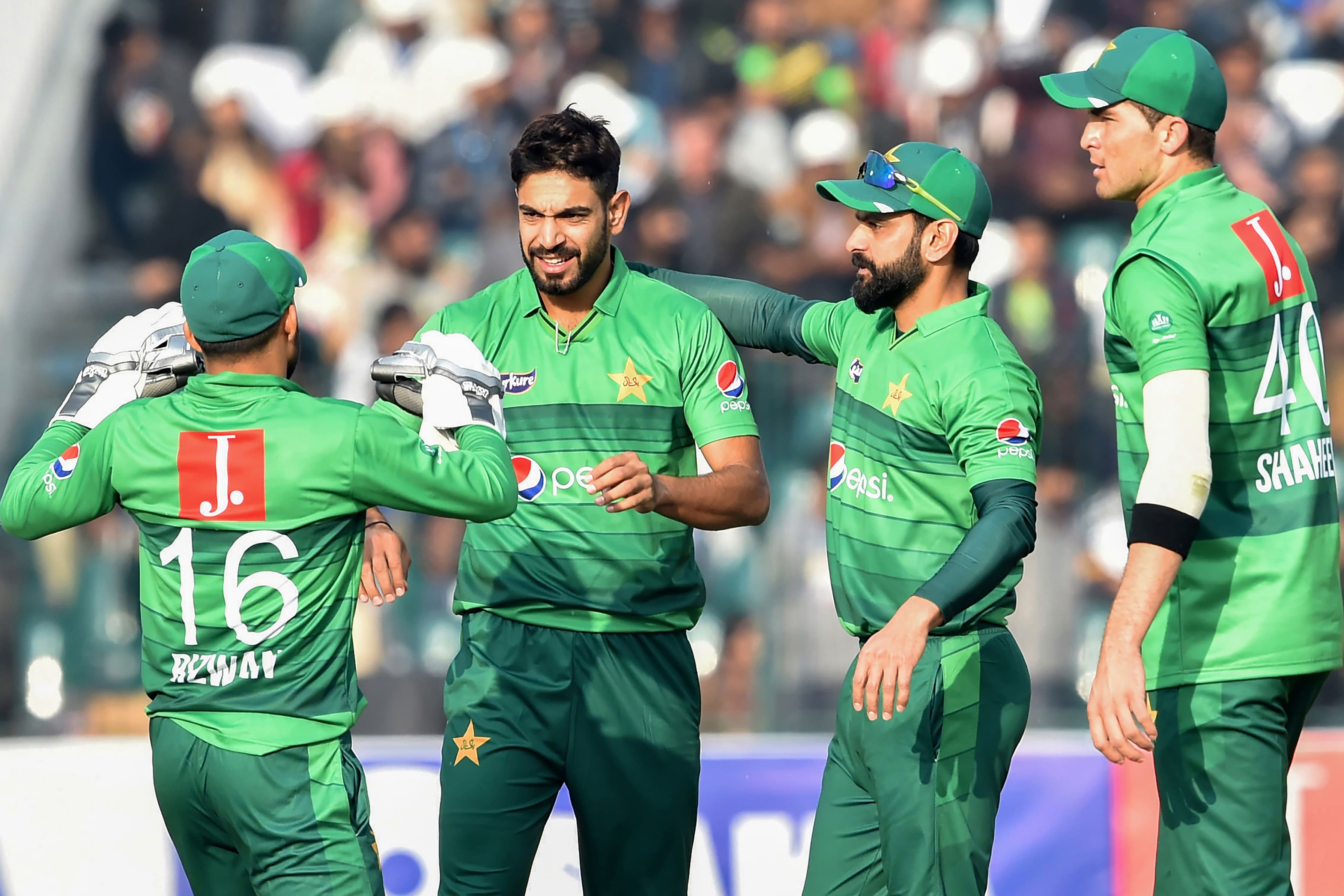 In this file photo taken on January 25, 2020 Pakistan's Haris Rauf (2ndL) celebrates with teammates the wicket of Bangladesh's Mahmudullah Riyad during the second T20 international cricket match of a three-match series between Pakistan and Bangladesh, at the Gaddafi Cricket Stadium in Lahore. (AFP)