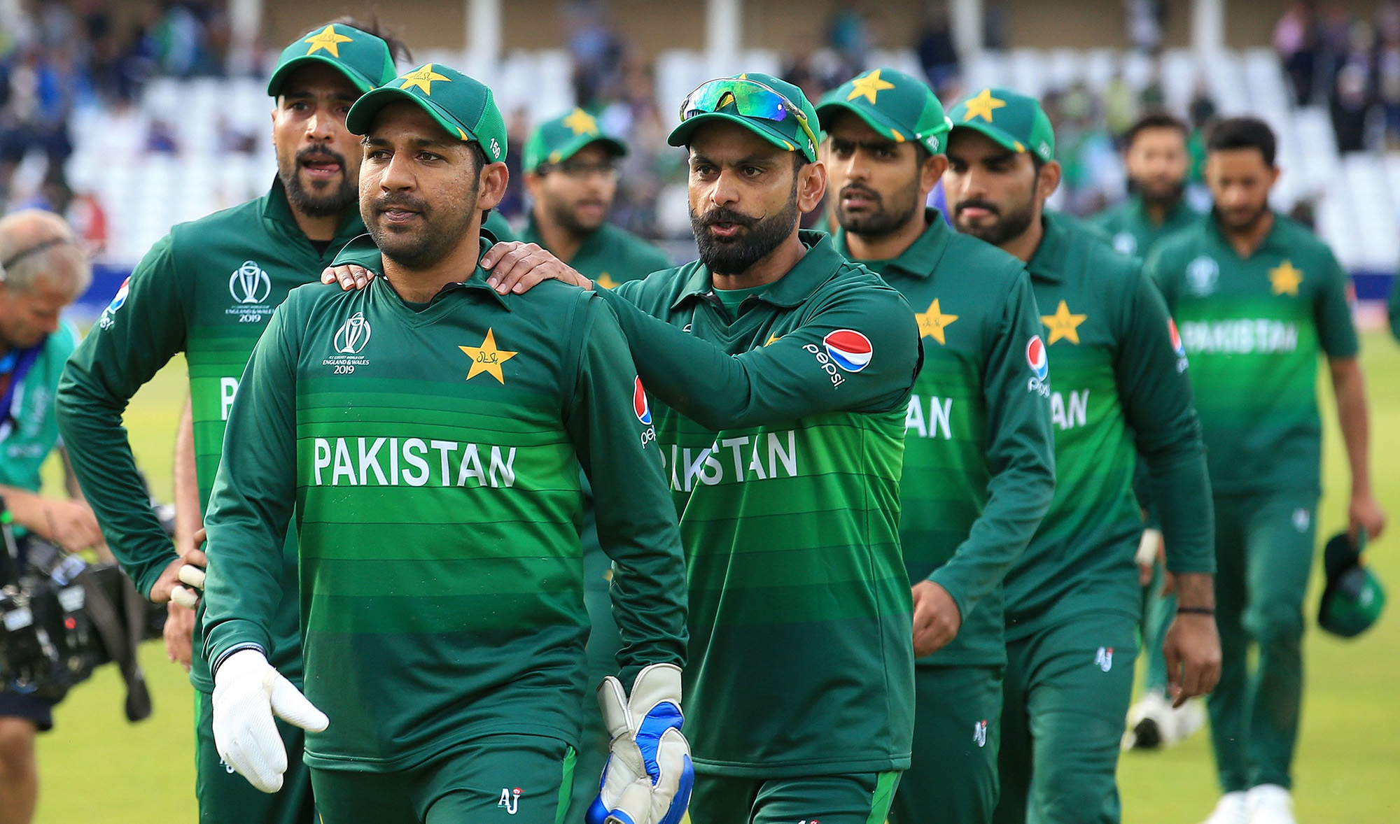 In this file photo, Pakistan's captain Sarfaraz Ahmed, second left, leads his team off of the pitch after winning the 2019 Cricket World Cup group stage match between England and Pakistan at Trent Bridge in Nottingham, central England, on June 3, 2019. (AFP)