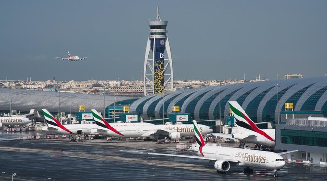 In this Dec. 11, 2019 file photo, an Emirates jetliner comes in for landing at Dubai International Airport in Dubai, United Arab Emirates. (AP)