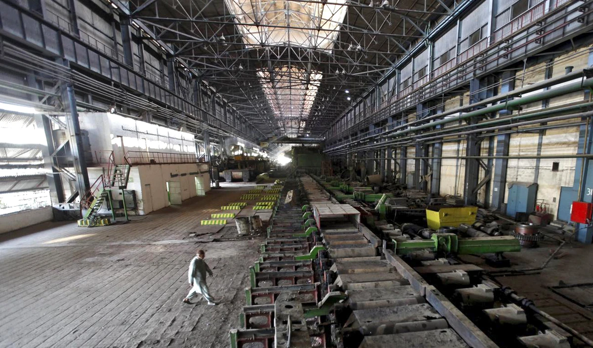 In this file photo, a man walks past machines at the hot strip mill department of the Pakistan Steel Mills (PSM) on the outskirts of Karachi on Feb. 8, 2016. (REUTERS)