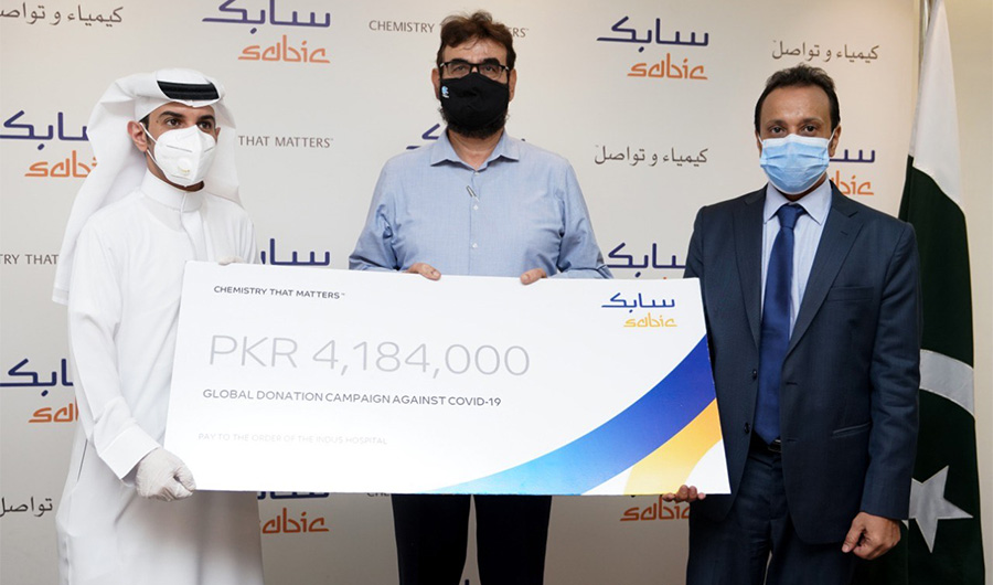 Saudi Consul General Bandar Fahad Al-Dayel and SABIC Pakistan general manager Saleh Ali Al-Zahrani present a cheque to Dr. Abdul Bari, CEO of the Indus Hospital, in Karachi on June 30, 2020. (Photo courtesy: Saudi Consulate in Karachi)
