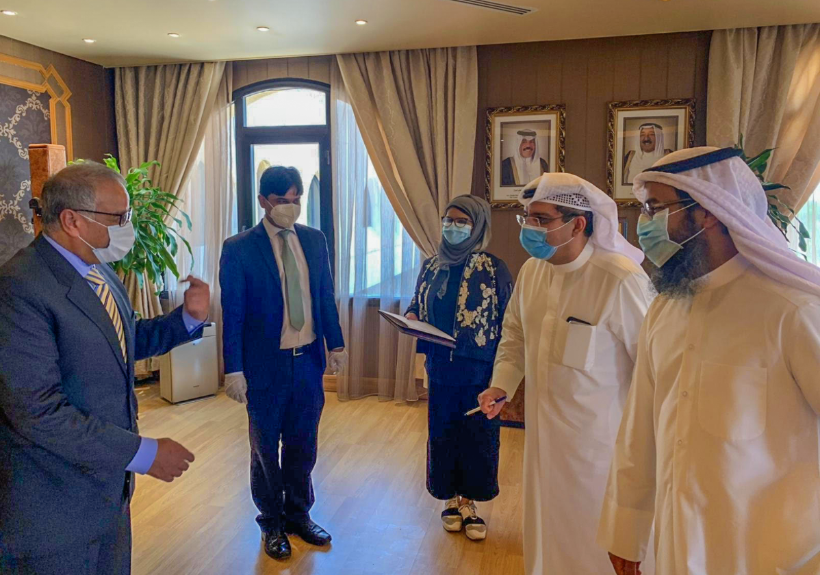 Undersecretary Ministry of Health in Kuwait Dr. Mustafa Reza ( Right in the middle ) with and the ambassador of Pakistan in Kuwait Syed Sajjad Haider (Left) at the headquarters of Kuwait's Health Ministry after signing a government to government agreement on Saturday July 04, 2020 to send 600 Pakistani healthcare professionals to work in Kuwait. ( Courtesy: Ministry of Health in Kuwait)