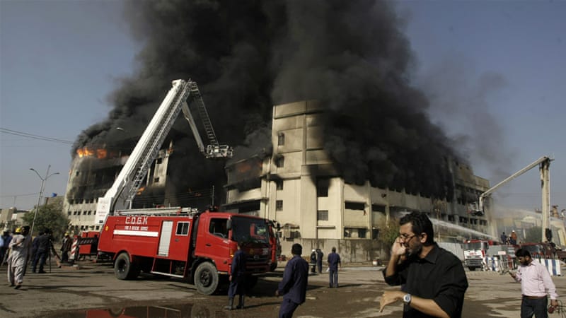 A firetruck stands outside the Baldia Town textile factory where a fire killed 259 people in Karachi, Pakistan, on September 11, 2012. (AP)