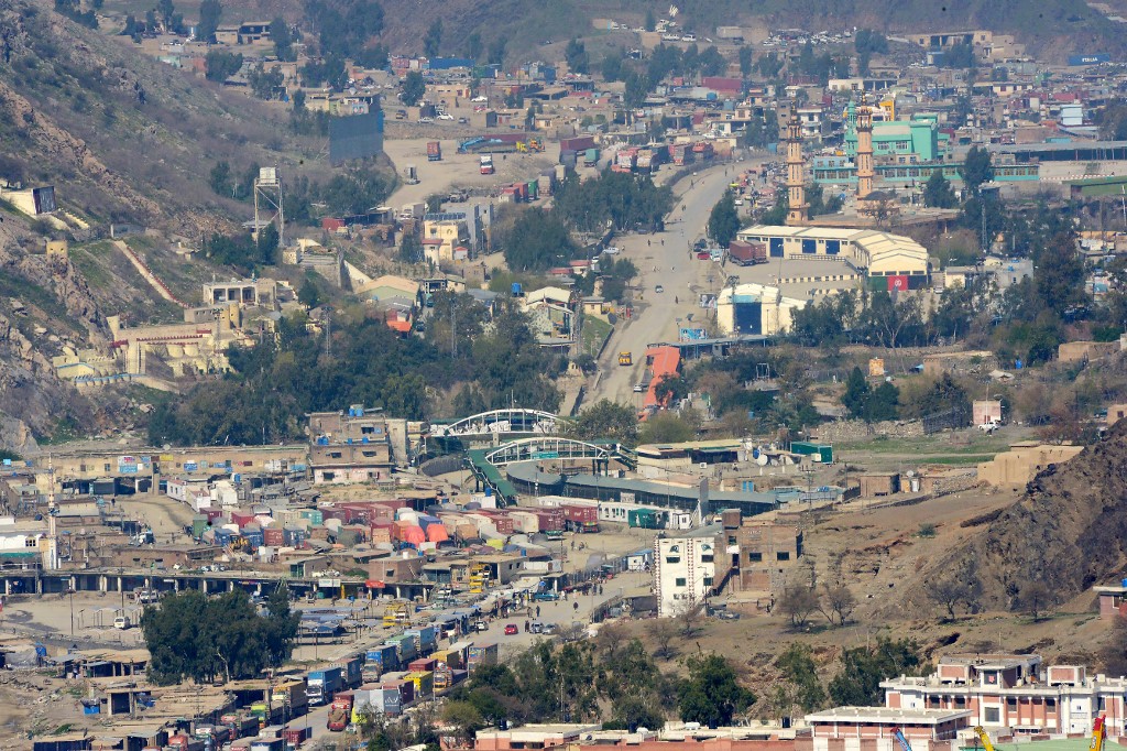Afghan trucks line up as they wait to cross the Pakistan-Afghanistan border closed amid concerns over the spread of COVID-19 in Torkham some 54 kilometers from Peshawar on March 16, 2020. (AFP)