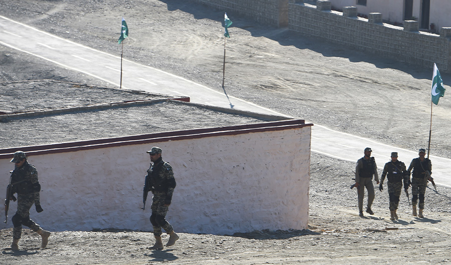 Pakistani army soldiers walk near a border terminal in Ghulam Khan, a town in North Waziristan, on the border between Pakistan and Afghanistan, on January 27, 2019. (AFP)
