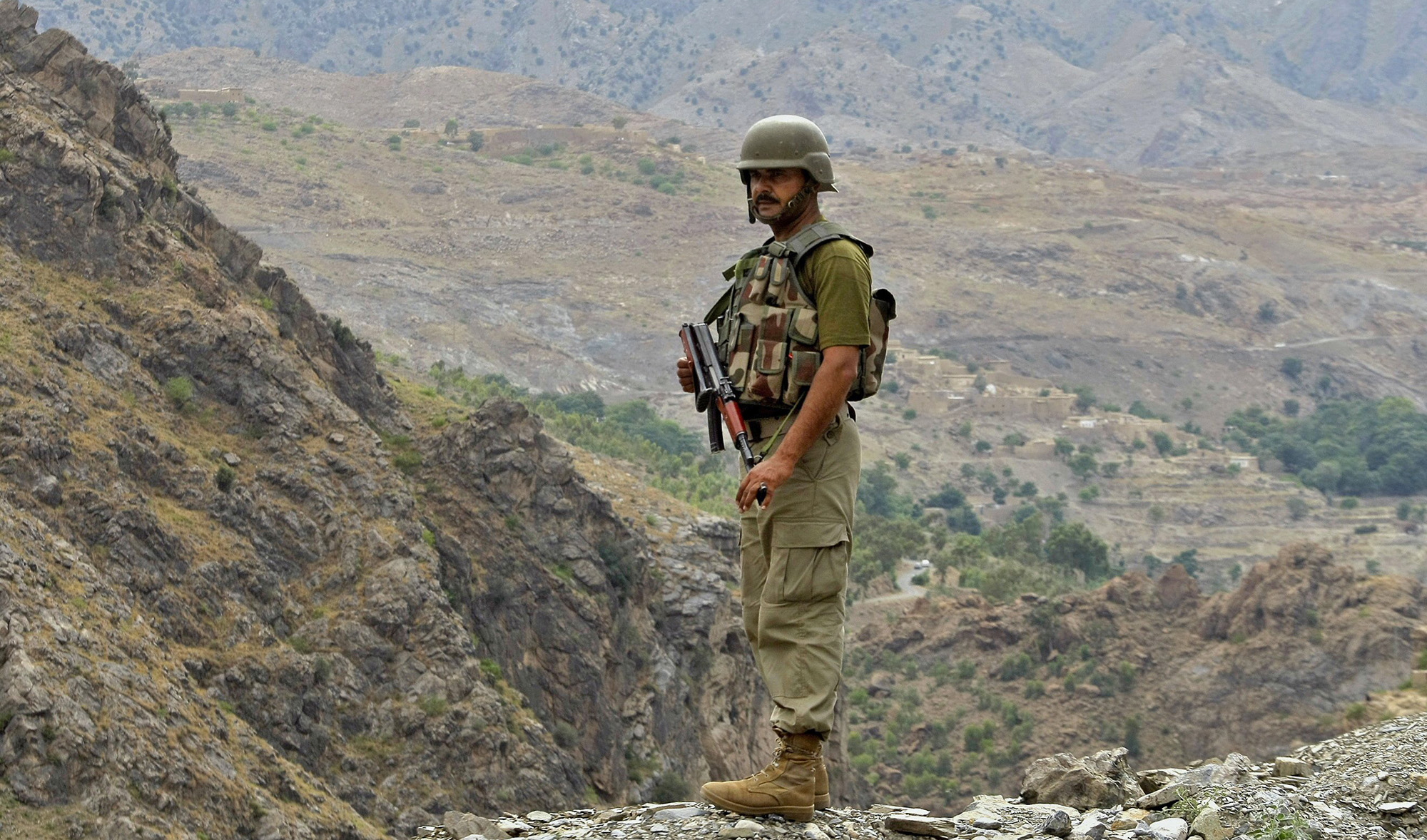 In this file photo, a Pakistani army soldier stands guard near Torkham border post between Pakistan and Afghanistan on June 15, 2016. (AP)