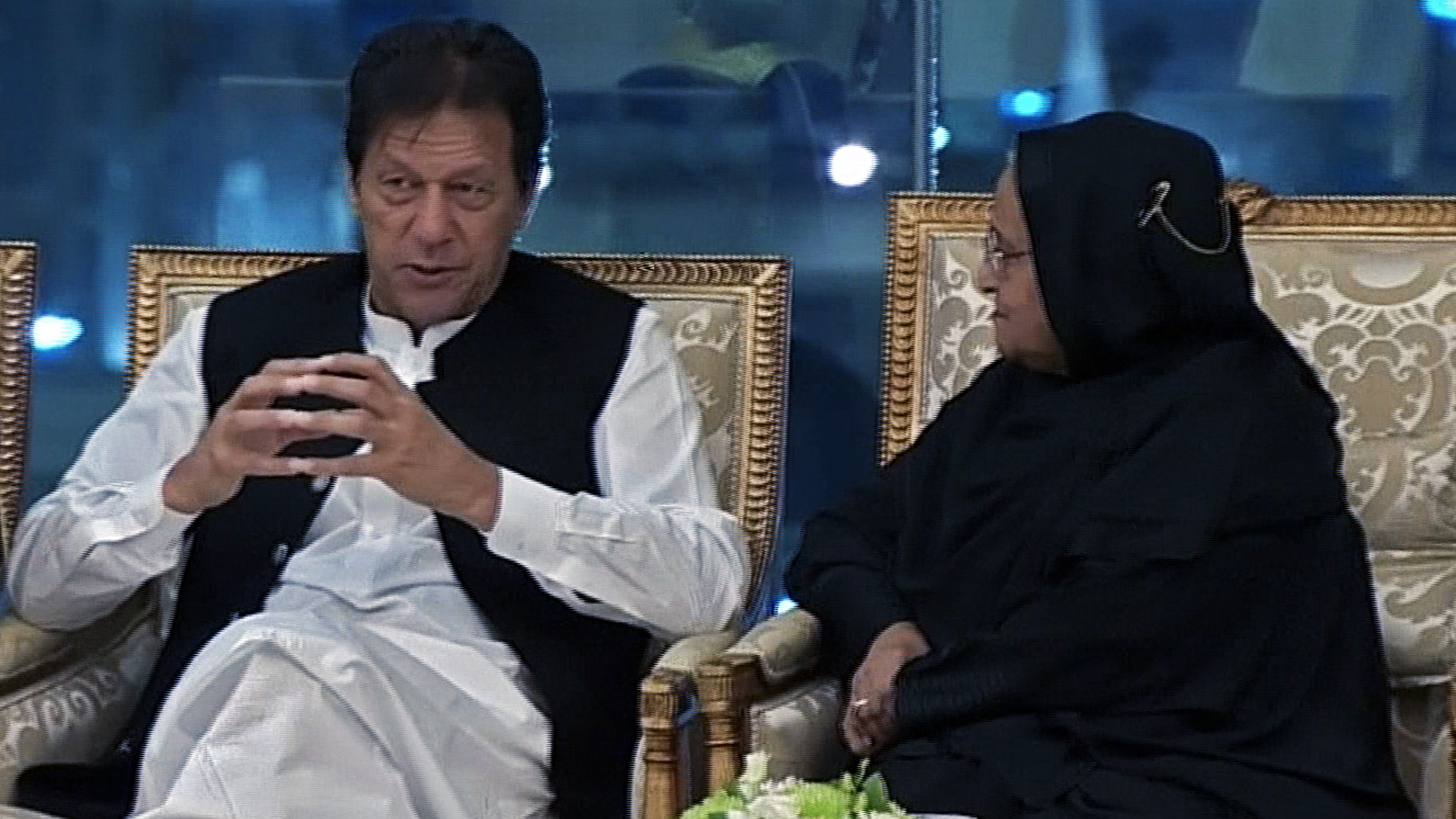 This still from a video recorded on June 1, 2019, shows Pakistani Prime Minister Imran Khan talking to Bangladeshi Prime Minister Sheikh Hasina during a summit of the Organization of Islamic Cooperation (OIC) held in Mecca. (AFP)