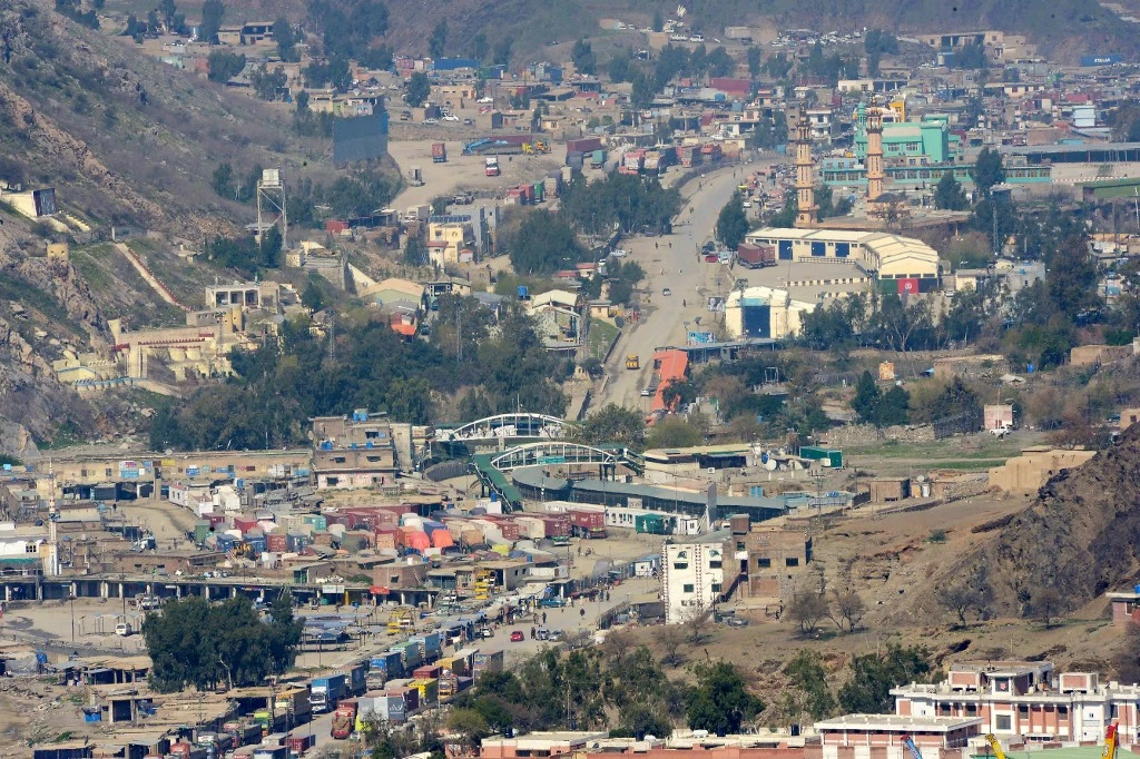 Afghan trucks line up as they wait to cross the Pakistan-Afghanistan border closed amid concerns over the spread of COVID-19 in Torkham some 54 kilometers from Peshawar on March 16, 2020. (AFP)