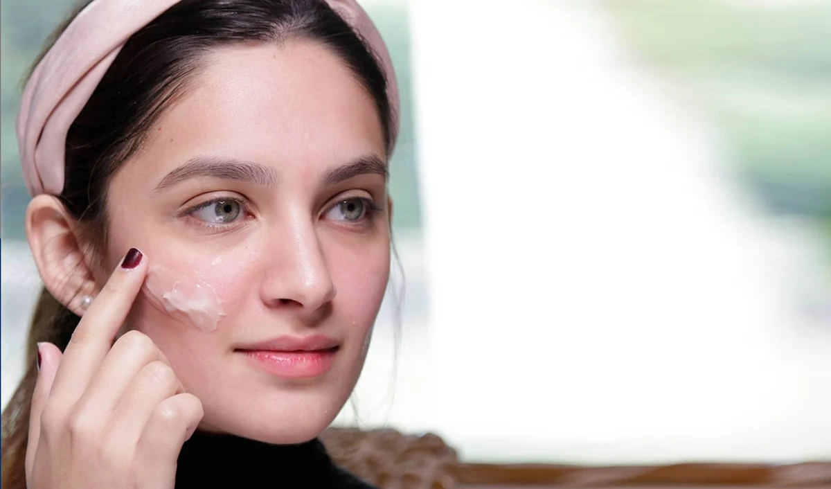 Beauty blogger Areesha Kamran applies Conatural’s Essential Day Cream from the company’s line of certified organic skin products in Lahore, Pakistan on July 11, 2020. (Conatural)