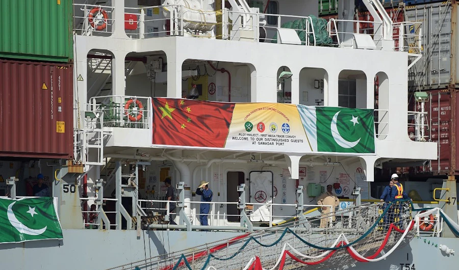 In this photograph taken on Nov. 13, 2016, Pakistani Naval personnel stand guard near a ship carrying containers at the Gwadar port, some 700 kms west of Karachi, during the opening ceremony of a pilot trade program between Pakistan and China. (AFP/File)