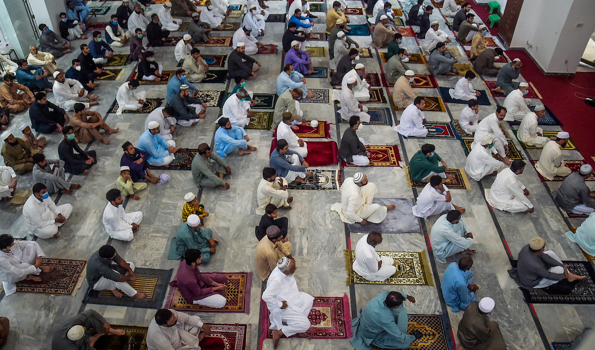 People offer prayers for the Eid Al-Adha, the feast of sacrifice, at a mosque in Rawalpindi on Aug. 1, 2020. (AFP)