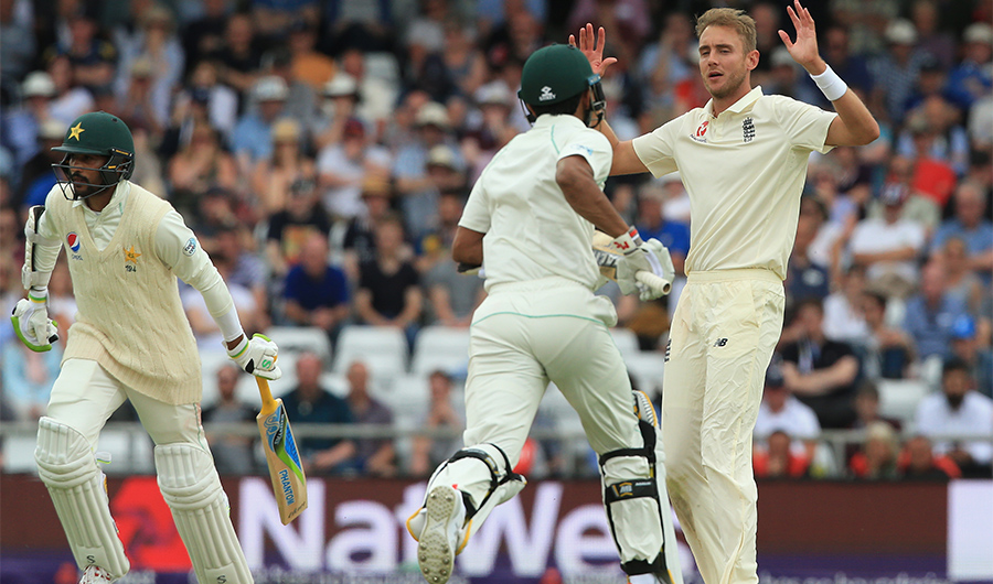 In this file photo, England's Stuart Broad (R) reacts on the third day of the second Test cricket match between England and Pakistan at Headingley cricket ground in Leeds, northern England on June 3, 2018. (AFP)