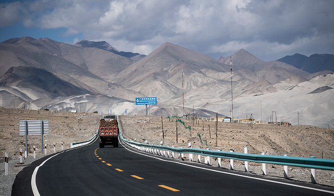 This picture taken on June 27, 2017 shows a truck driving along the China-Pakistan Friendship Highway before the Karakorum mountain range near Tashkurgan in China's western Xinjiang province. (AFP)