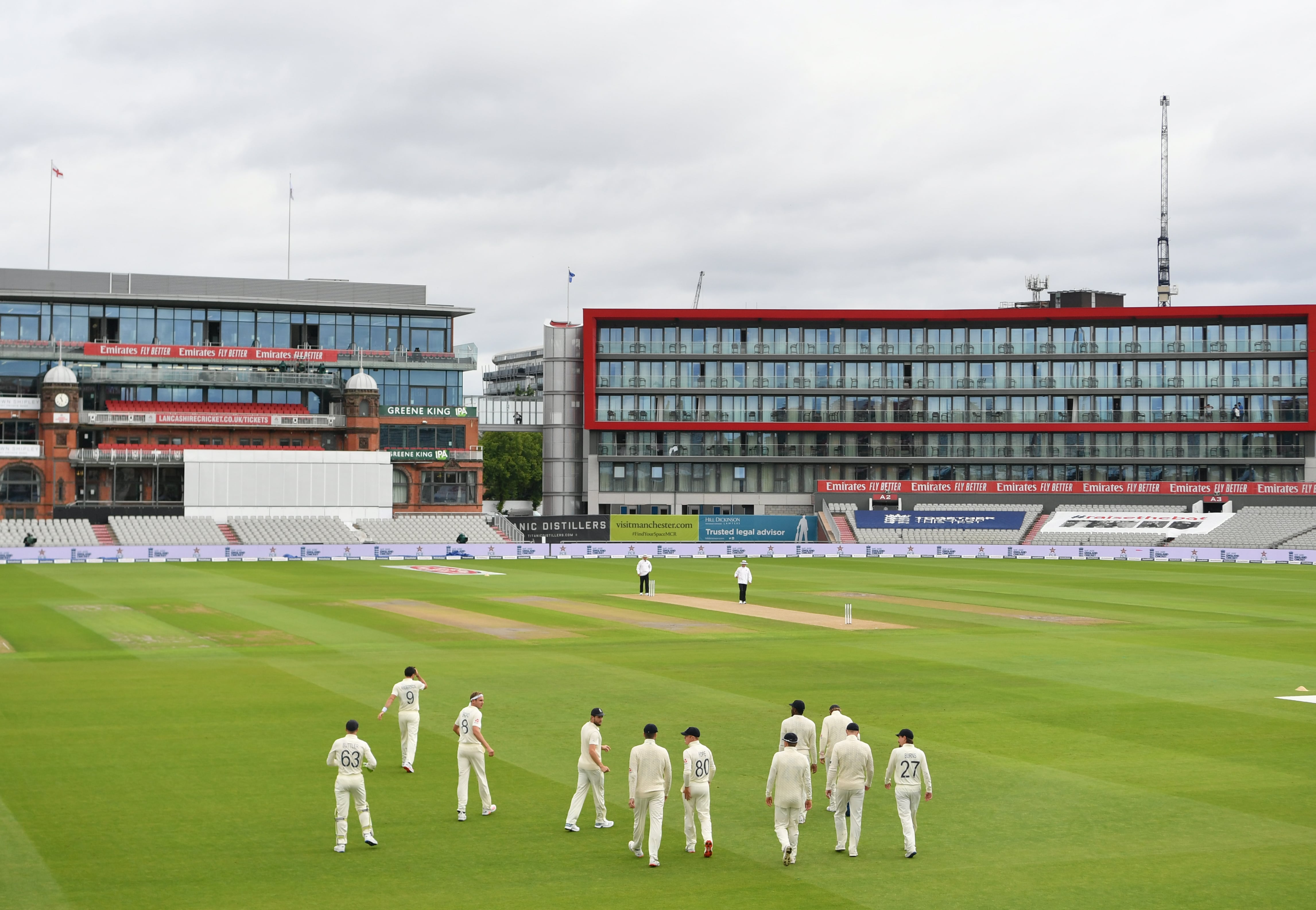 England players walk onto the pitch on the first day of the first Test cricket match between England and Pakistan at Old Trafford in Manchester, northwest England on August 5, 2020. (AFP)