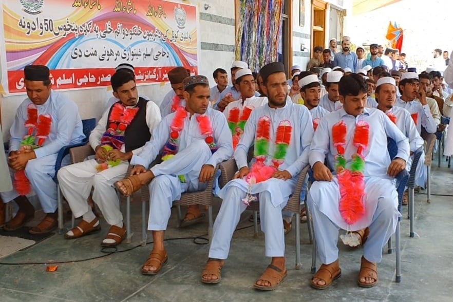 Garlanded grooms attend a mass wedding ceremony in Landikotal, Khyber Pakhtunkhwa on Aug. 5, 2020. (Photo courtesy: Shinwari Welfare Organization)