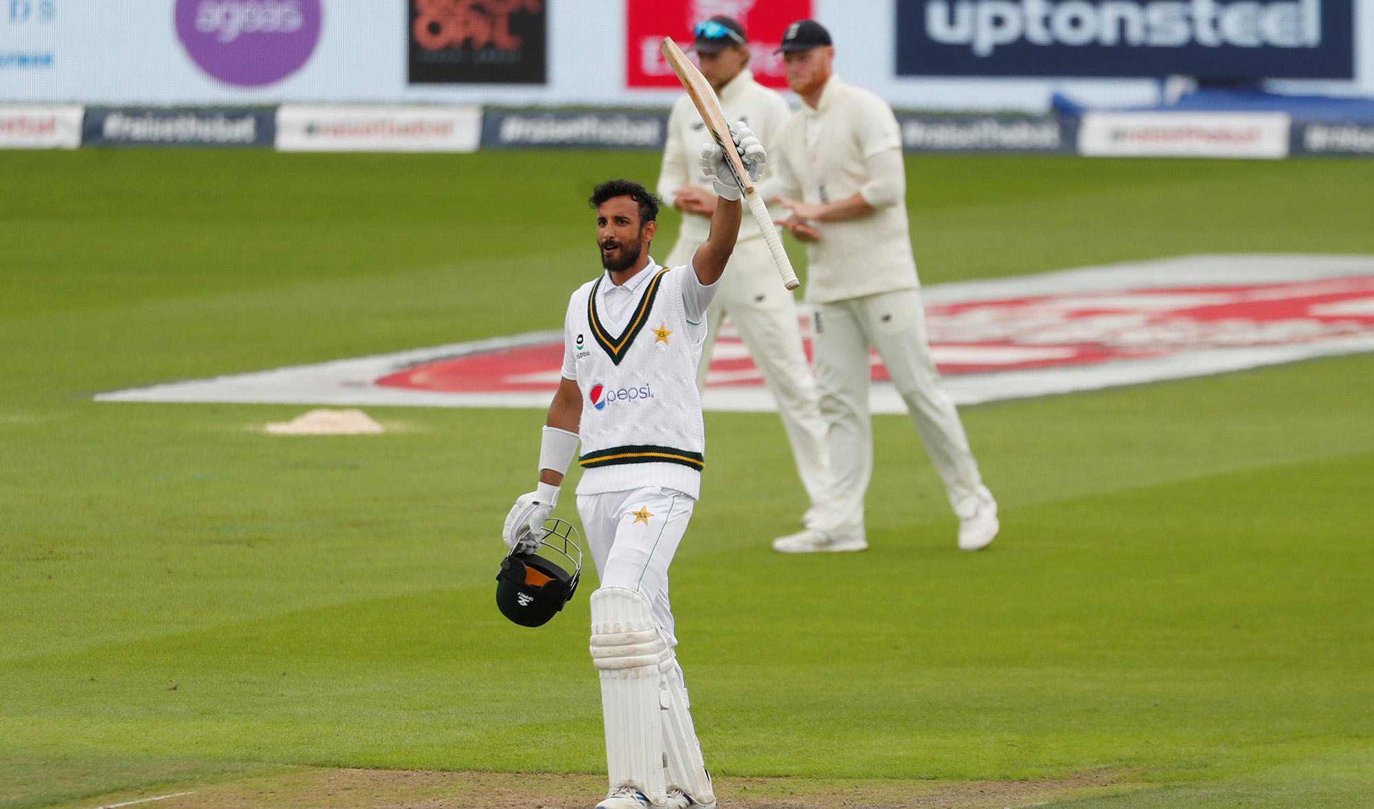 Pakistan's Shan Masood celebrates his century, as play resumes between Pakistan and England behind closed doors at Emirates Old Trafford in Manchester, Britain on Aug. 6, 2020. (REUTERS)