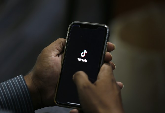 A man opens social media app 'Tik Tok' on his cell phone, in Islamabad, Pakistan, Tuesday, July 21, 2020. (AP)