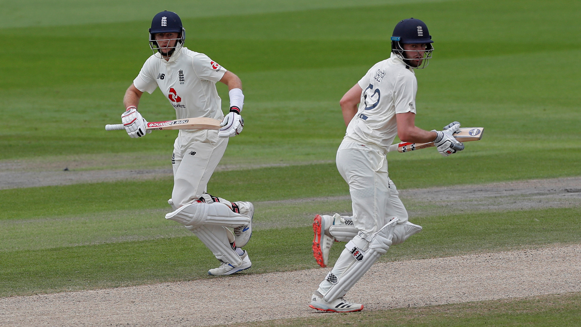 England's Joe Root and Dom Sibley in action during the first test cricket match against Pakistan at Emirates Old Trafford in Manchester, Britain, on Aug. 8, 2020. (REUTERS)