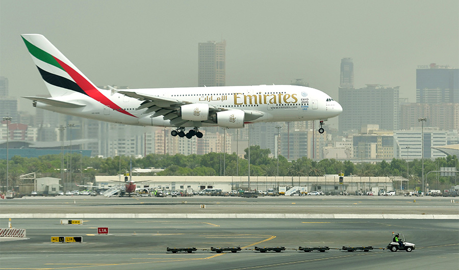 A picture take on September 14, 2017 shows an Airbus A380 of Emirates landing at the tarmac at Dubai's International Airport. (AFP)