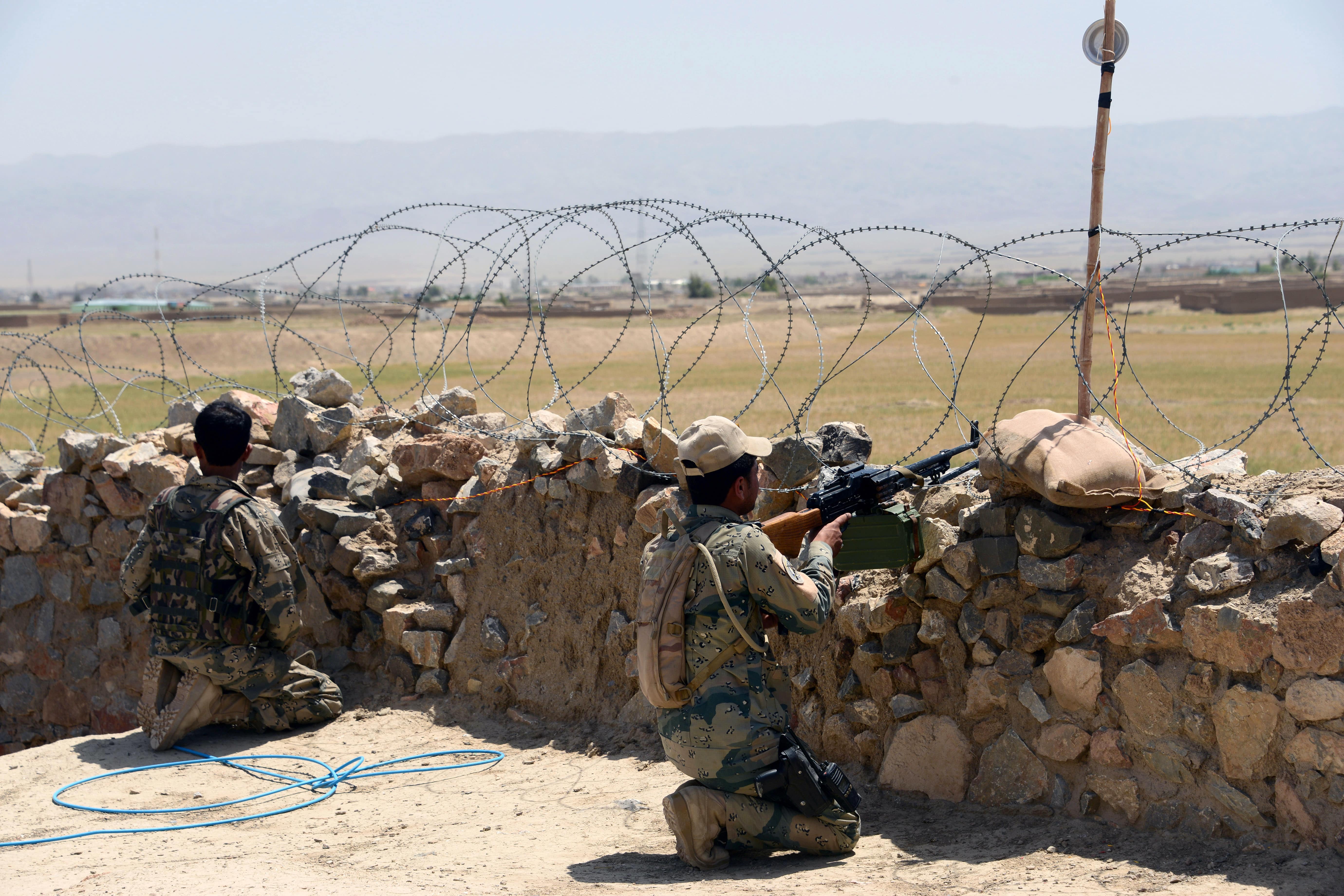 Afghan Border Police personnel keep watch during an ongoing battle between Pakistani and Afghan Border forces near the Durand line at Spin Boldak, in southern Kandahar province on May 5, 2017. (AFP)