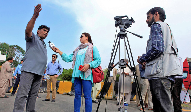 In this file photo, journalists work during a demonstration to mark World Press Freedom Day in Islamabad on May 3, 2018. Earlier this week, an official notification circulated by the Establishment Division, restricting civil servants from speaking to the media without securing the government's prior consent. (REUTERS)