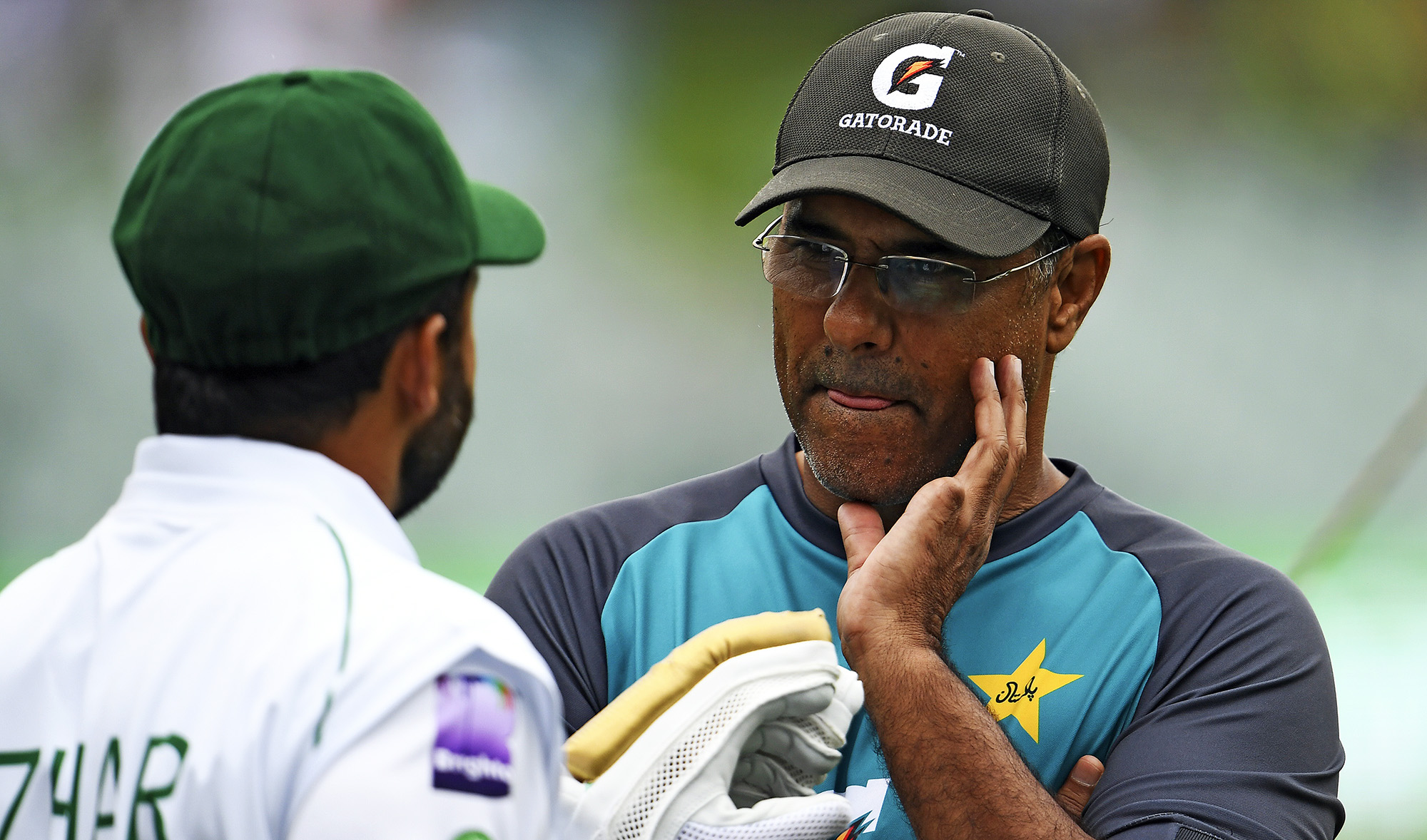 Pakistan's bowling coach Waqar Younis, right, talks to the team's captain Azhar Ali prior to the first day of the second cricket Test match between Australia and Pakistan in Adelaide on Nov. 29, 2019. (AFP/File)
