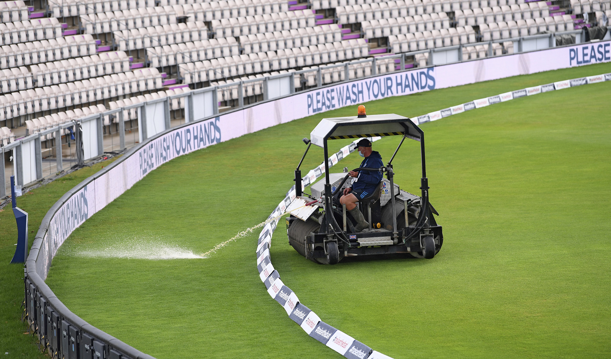 A super sopper is used to remove rainwater from the field ahead of the fifth day of the second cricket Test match between England and Pakistan, at the Ageas Bowl in Southampton, England, Monday, Aug. 17, 2020. (Pool via AP)