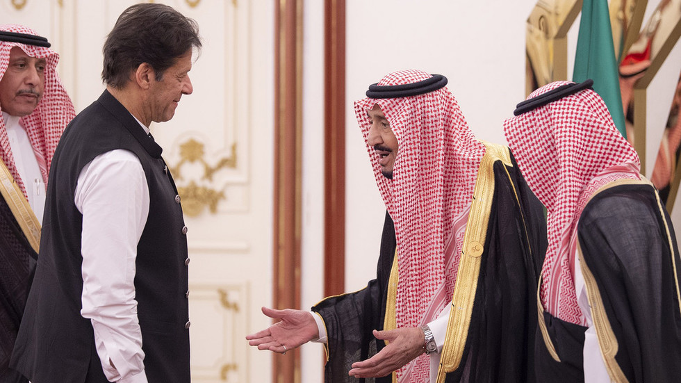This handout photo released by the Saudi Royal Palace shows King Salman bin Abdulaziz (C) of Saudi Arabia welcoming Pakistani Prime Minister Imran Khan (L) at the opening session of a summit of the 57-member Organization of Islamic Cooperation (OIC) in the Saudi holy city of Mecca in the early hours of June 1, 2019. (AFP)