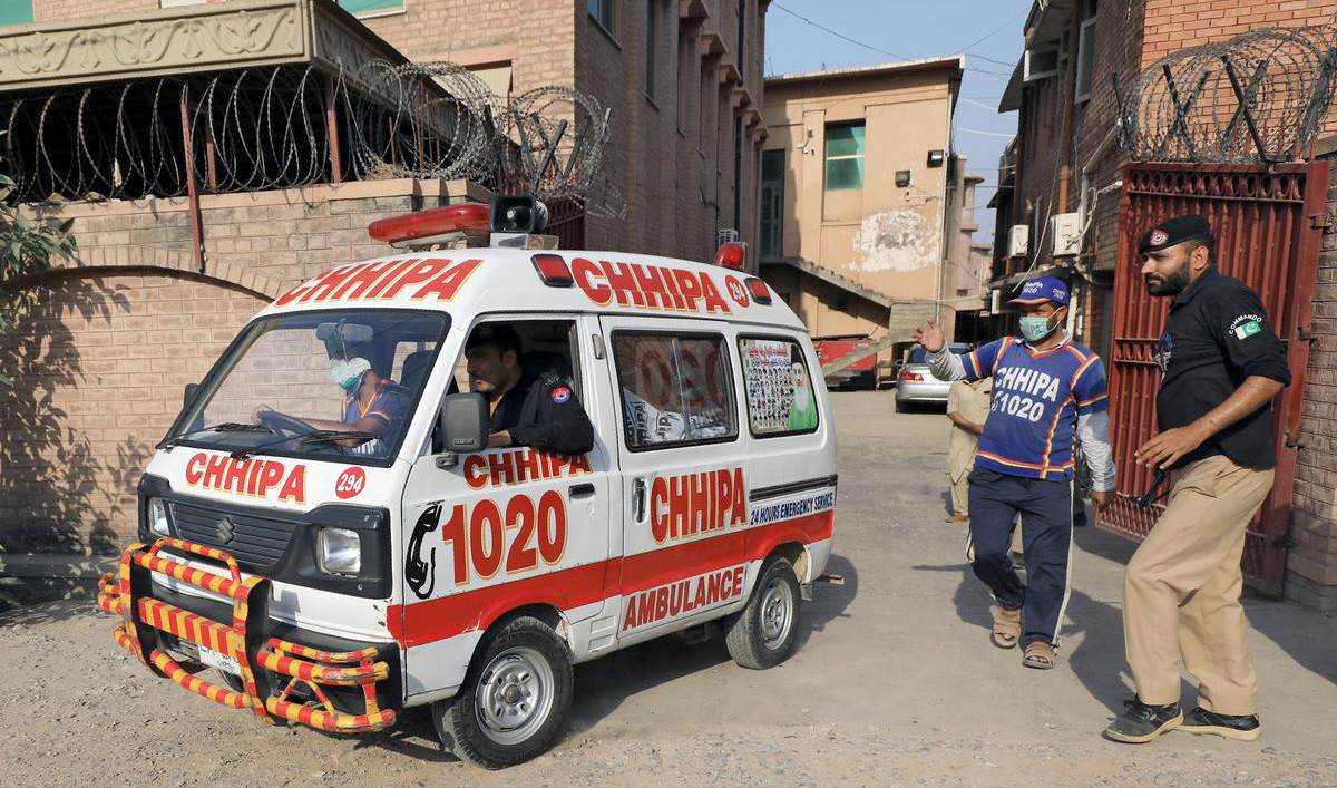 An ambulance carrying the body of a man, who according to police was killed by a gunman during a proceeding at a judicial complex, moves out of the Khyber Medical College (KMC) morgue, in Peshawar on July 29, 2020. (REUTERS/File)