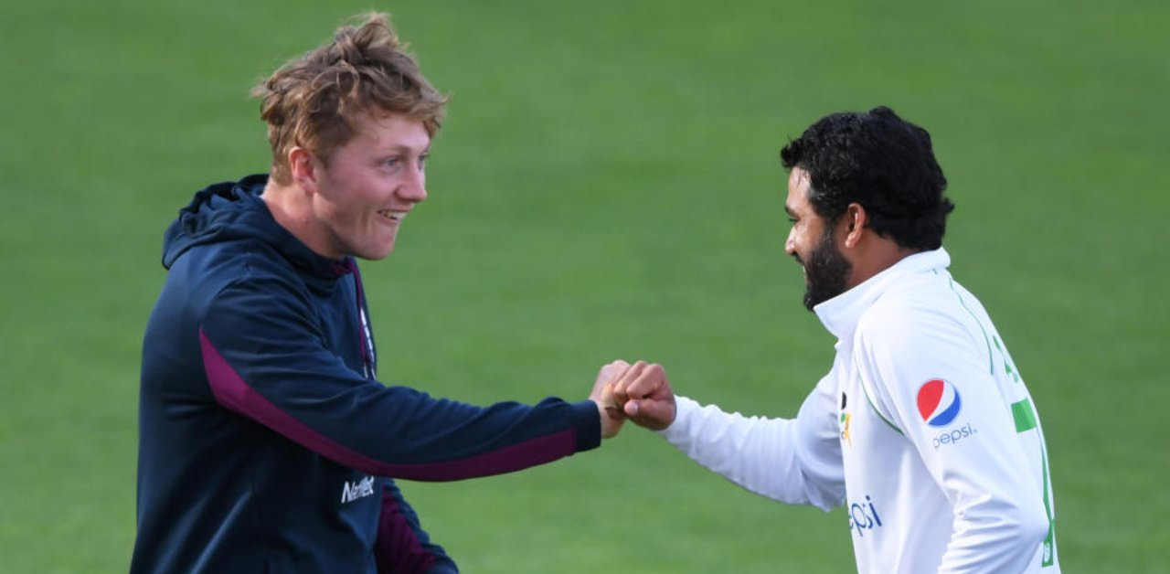 Pakistan's Azhar Ali and England's Dom Bess fist pump after the test match is drawn, as play resumes behind closed doors following the outbreak of the coronavirus disease. (Reuters Photo)