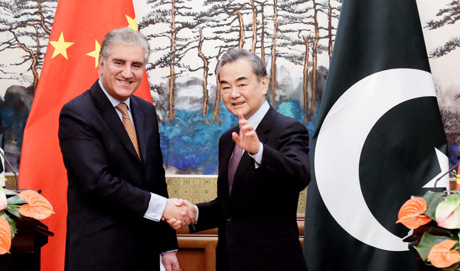 In this file photo, chinese Foreign Minister Wang Yi and Pakistani Foreign Minister Shah Mehmood Qureshi shake hands after a news conference at the Diaoyutai State Guesthouse in Beijing, China on March 19, 2019. (Reuters)