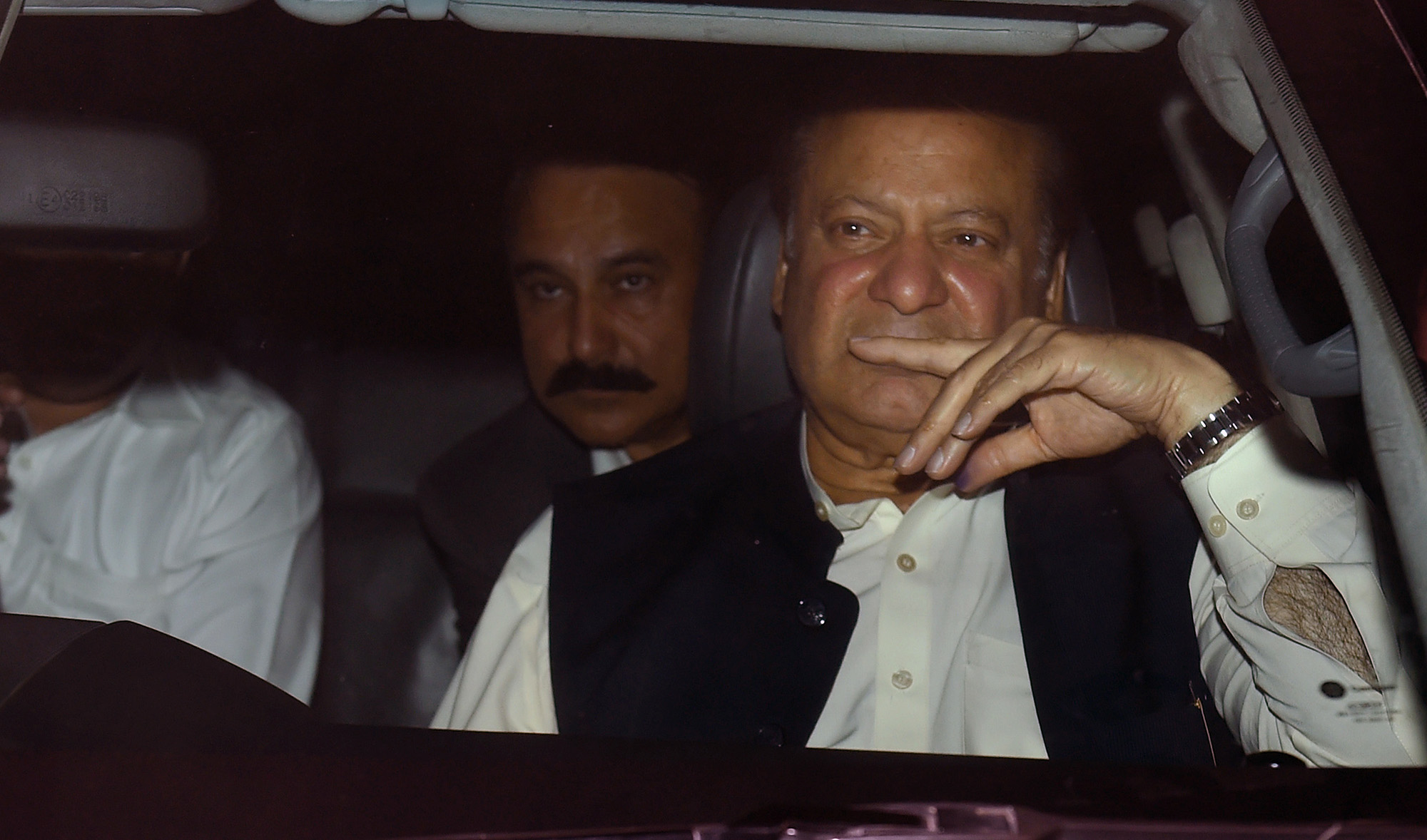 Pakistani former prime minister Nawaz Sharif, right, leaves the Kot Lakpat jail after his release in Lahore on March 27, 2019. (AFP/File)