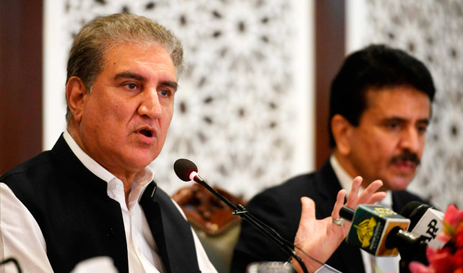 Pakistan's Foreign Minister Shah Mahmood Qureshi (L) speaks during a press conference at the Foreign Ministry in Islamabad on August 24, 2020. (AFP)